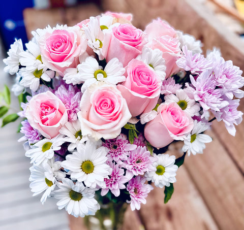 Pink roses with pink and white chrysanthemums stylish bouquet