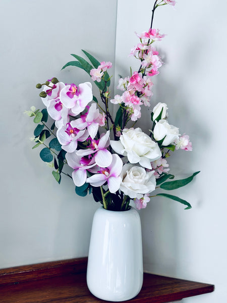 Pink tones and white orchid cherry blossom and rose vase