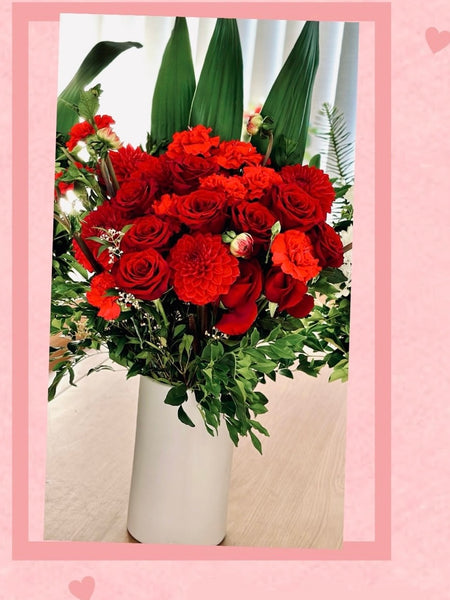 Red roses carnations and dahlias