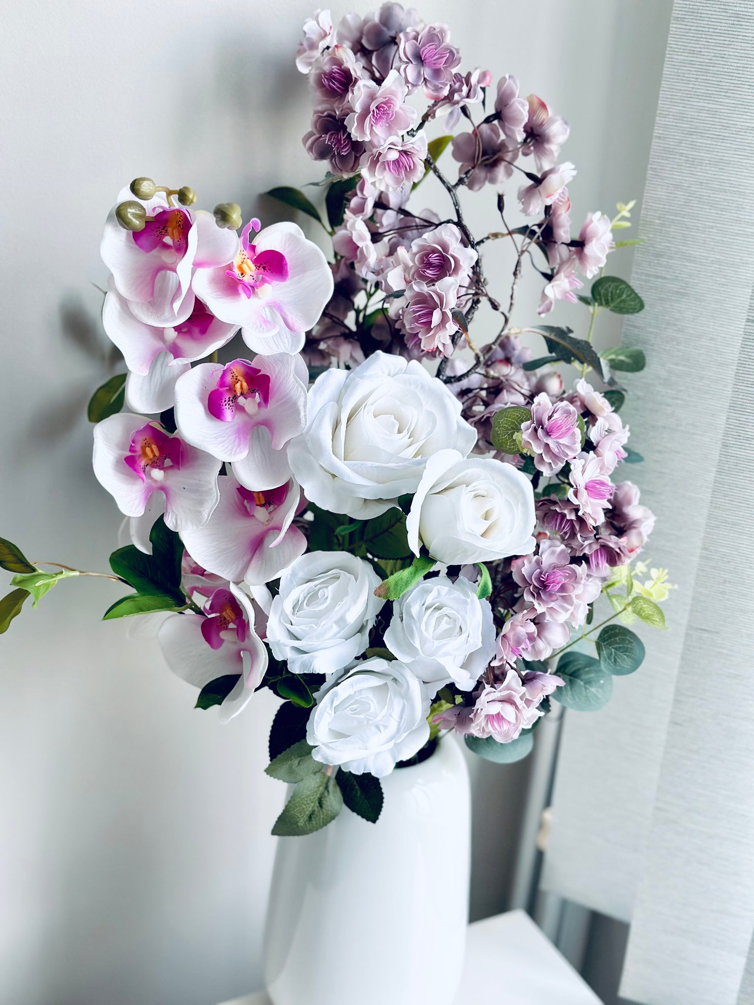 Orchid cherry blossom and rose vase