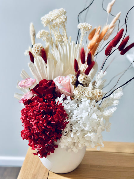 Vibrant red pink and white dry vase arrangement