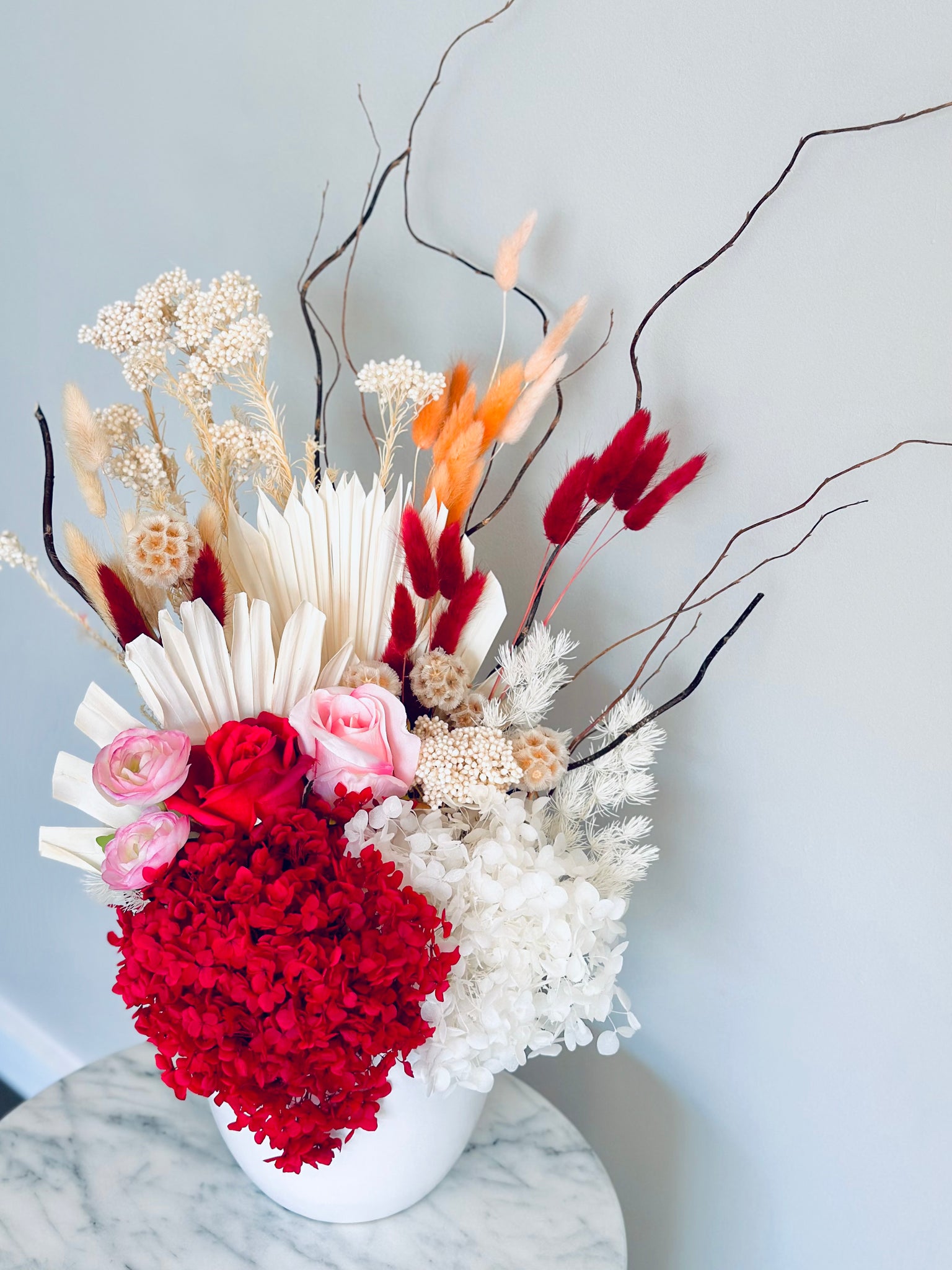 Vibrant red pink and white dry vase arrangement