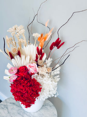 Vibrant red pink and white dry vase arrangement