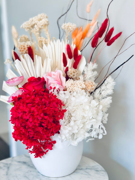 Vibrant red pink and white dry vase arrangement