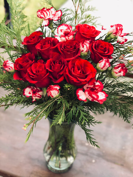 Red rose carnation and pine bouquet