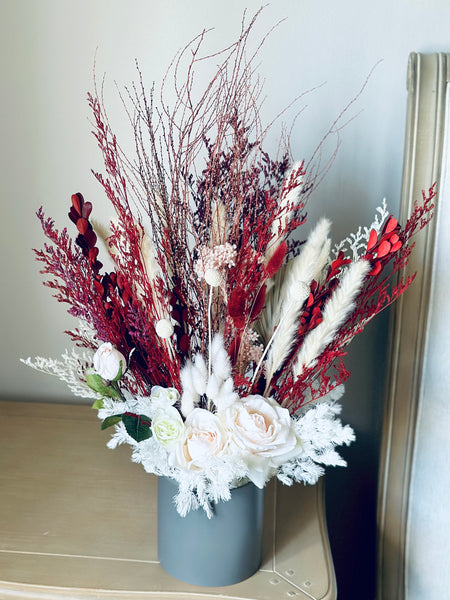 Pink roses, ranunculus with red and white dry flowers