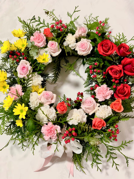 Multicoloured floral rose sympathy wreath