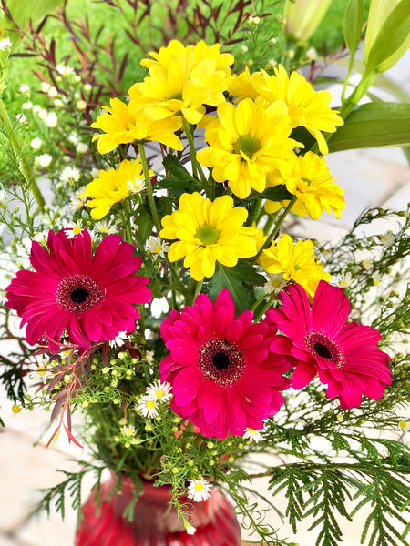 Beautiful pink Gerbera and yellow chrysanthemums