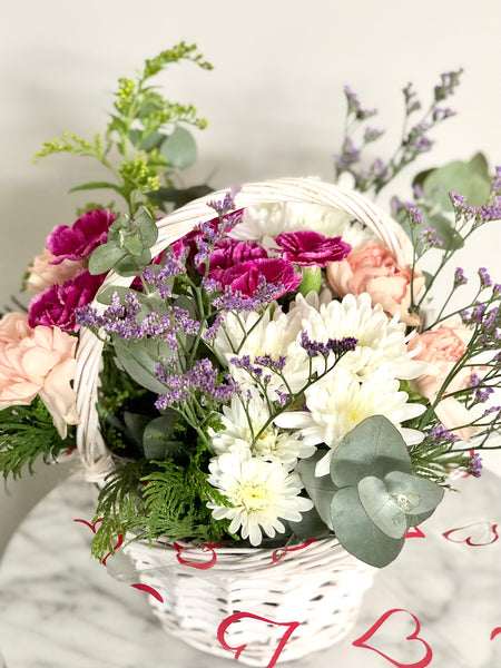 Basket of chrysanthemums and carnations