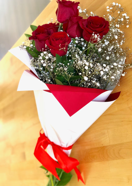 Six red long stem roses