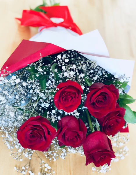 Six red long stem roses