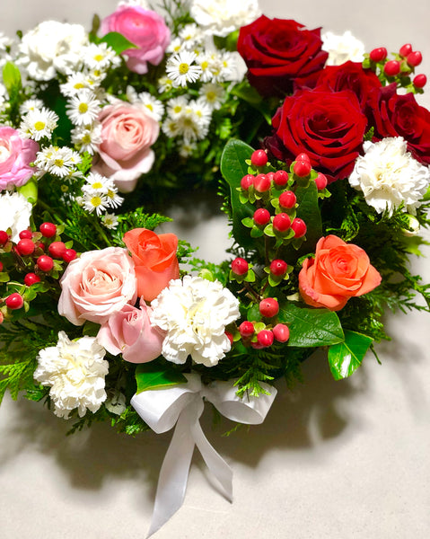 Multicoloured floral rose sympathy wreath