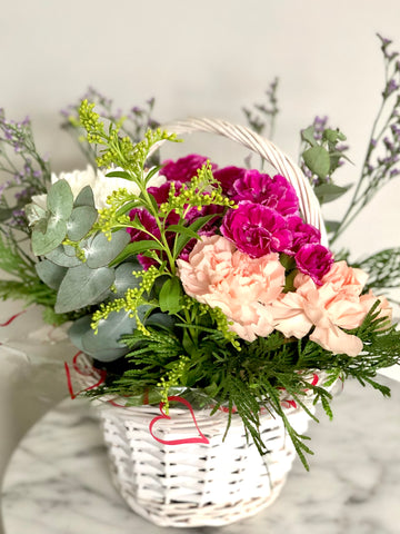 Basket of chrysanthemums and carnations