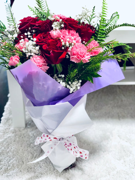 Roses, carnations and baby’s breath bouquet