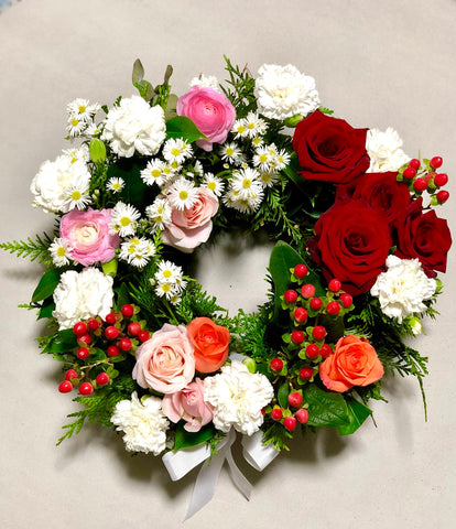 Multicoloured floral rose sympathy wreath