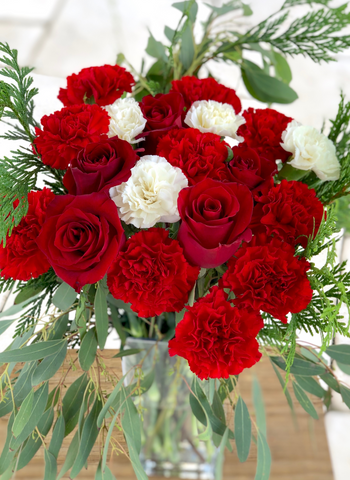 Romantic red and white roses and carnations