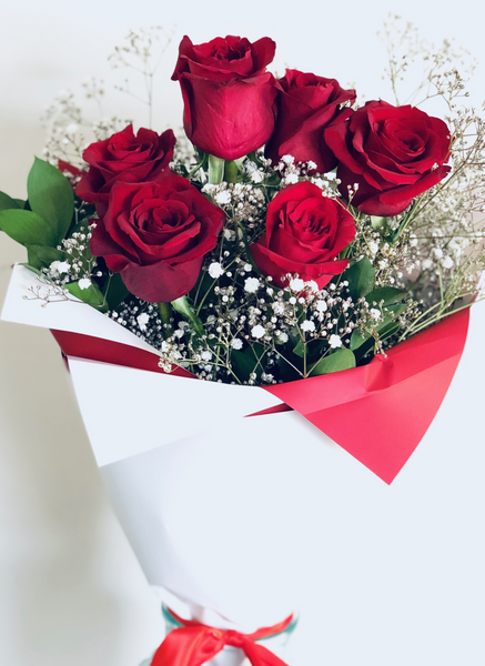 Six red long stem roses